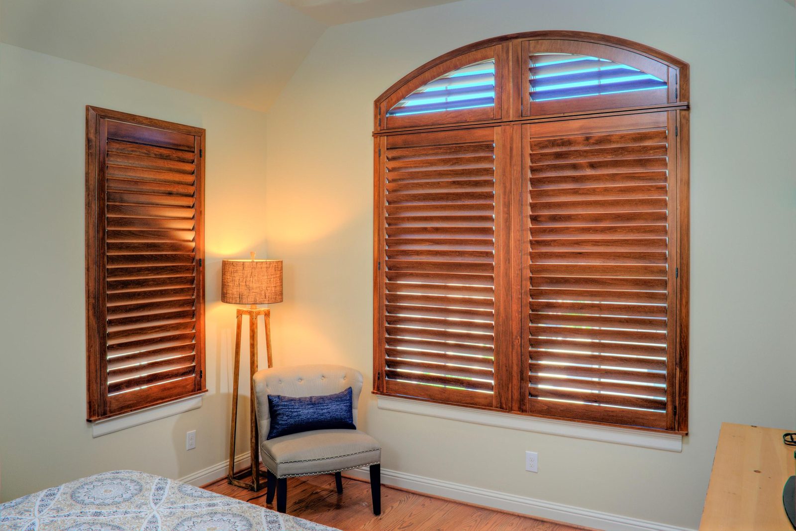 Monon dark wood shutters in a bedroom